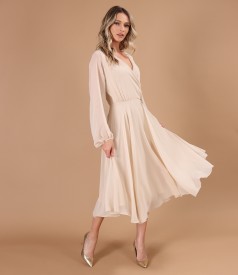 Elegant veil dress with a golden brooch at the waist