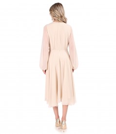 Elegant veil dress with a golden brooch at the waist