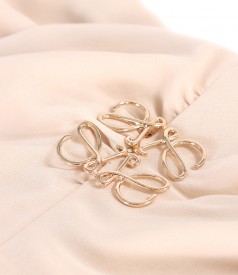 Elegant veil dress with a golden brooch at the waist