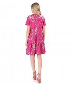 Elegant dress with frill made of elastic fabric printed with polka dots