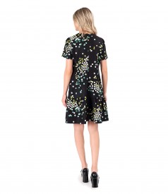 Elegant dress with frill made of elastic fabric printed with polka dots