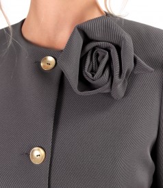 Elegant jacket made of textured fabric with a detachable brooch at the neckline