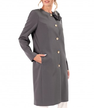 Elegant jacket made of textured fabric with a detachable brooch at the neckline