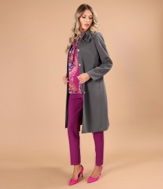 Elegant jacket made of textured fabric with a detachable brooch at the neckline