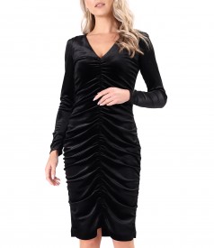 Elegant dress made of elastic velvet wrinkled on the front