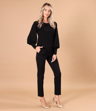 Elegant outfit with ankle pants and blouse with wide sleeves