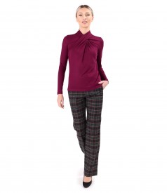 Elegant outfit with checkered pants and blouse with pleats at the neckline