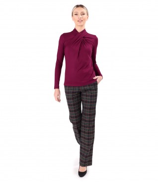 Elegant outfit with checkered pants and blouse with pleats at the neckline