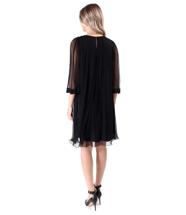 Dress made of natural silk voile with removable brooch