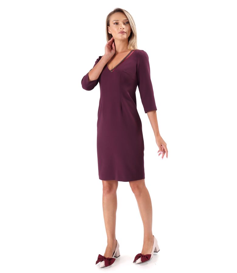 Office dress with decorative chain at the neckline