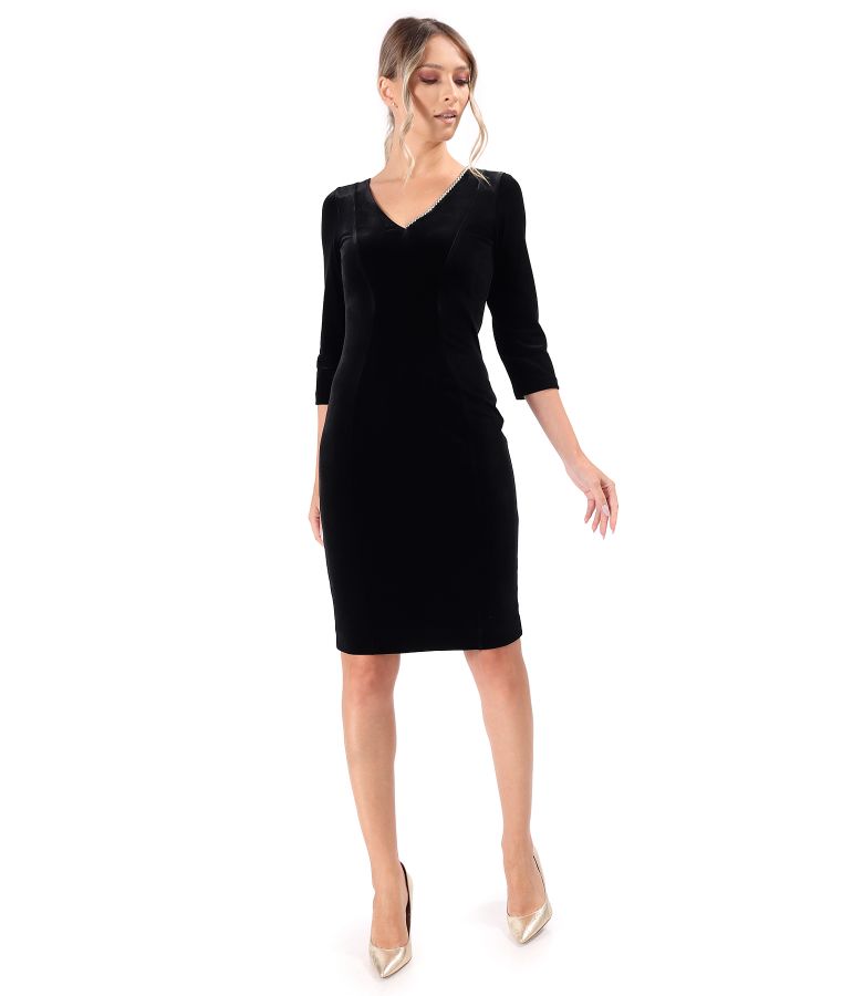 Elegant dress made of black elastic velvet with pearls at the neckline
