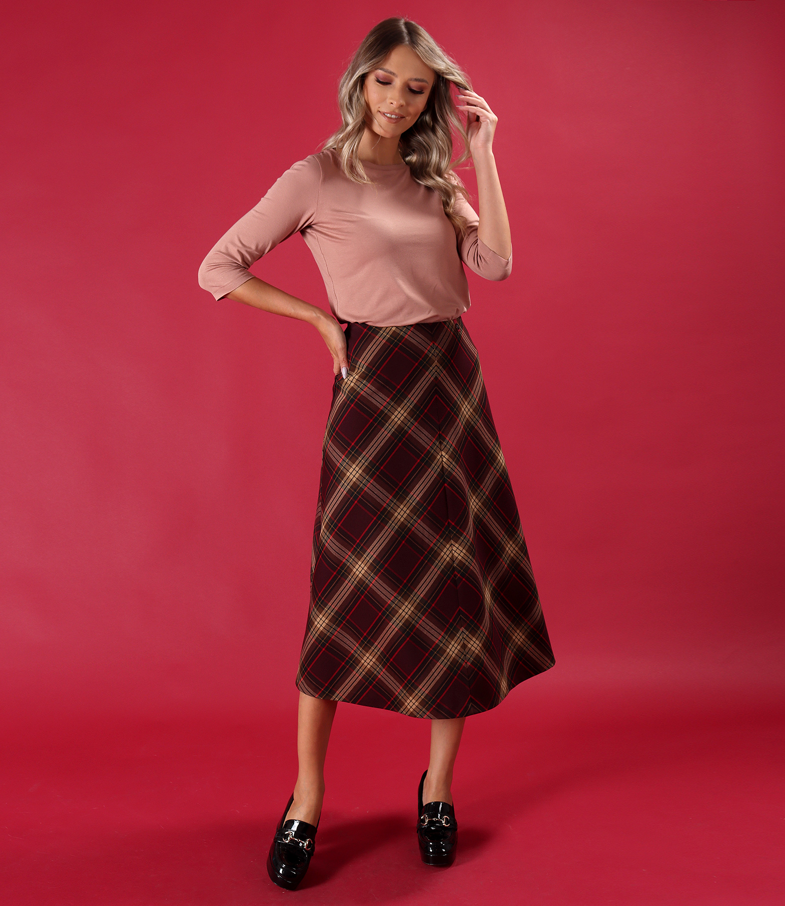 Elegant outfit with stretch jersey blouse and checked midi skirt