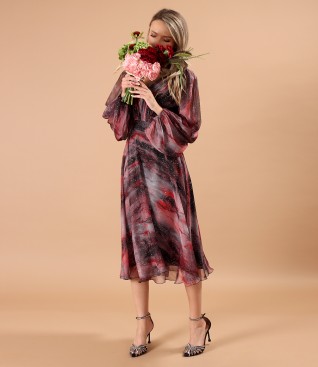 Elegant dress made of printed veil with golden motifs