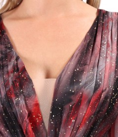 Elegant dress made of printed veil with golden motifs