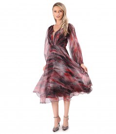 Elegant dress made of printed veil with golden motifs
