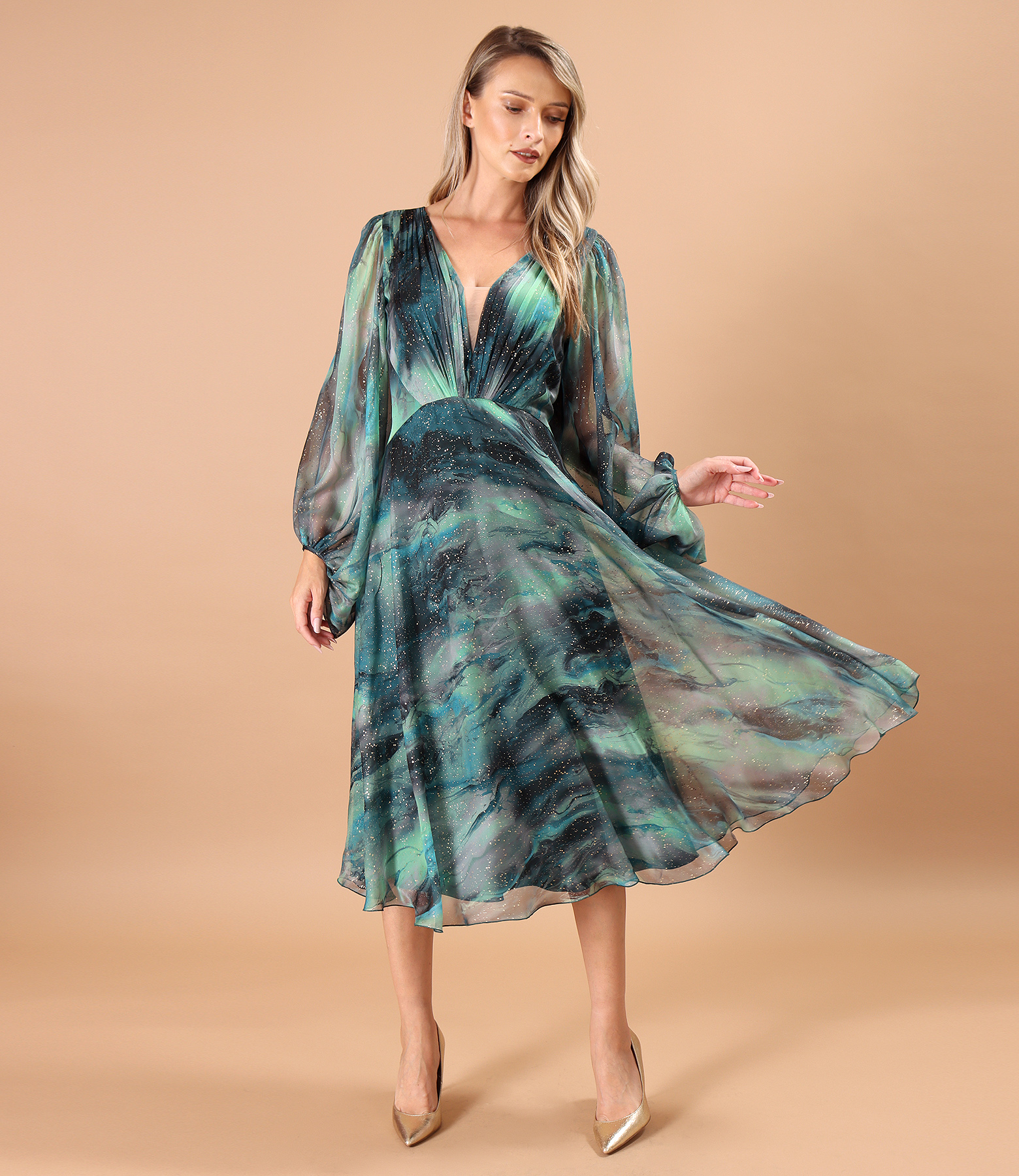 Elegant dress made of printed veil with golden motifs