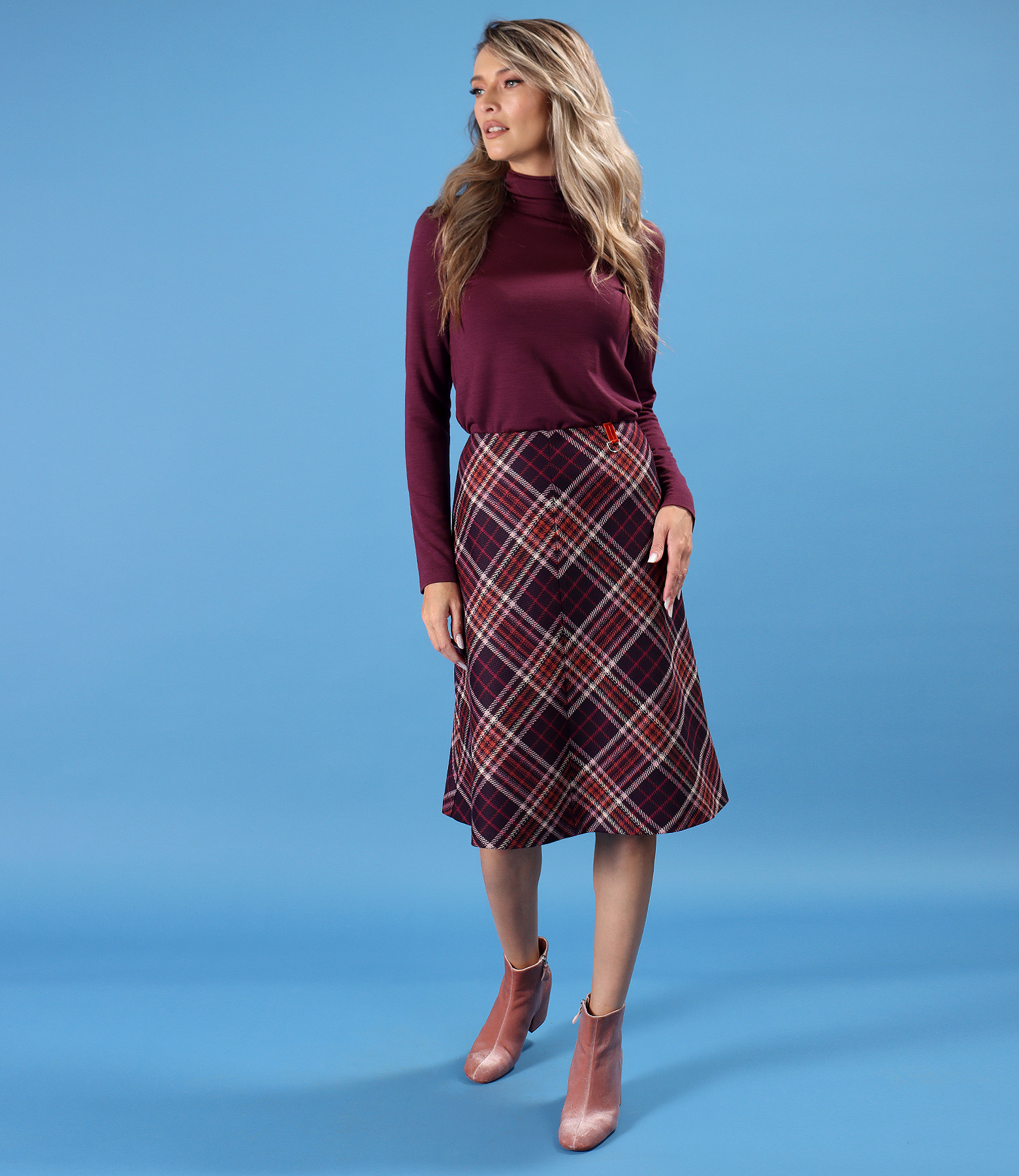 Flared plaid skirt with a long-sleeved turtleneck