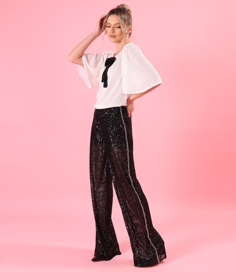 Elegant outfit with sequined pants and blouse