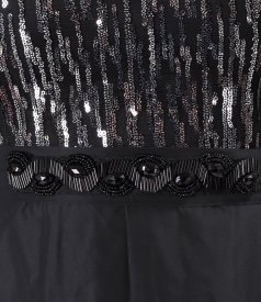 Long cocktail dress with voluminous sleeves and a sequin bodice