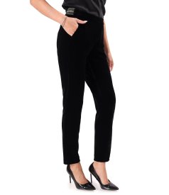 Black stretch velvet tapered trousers