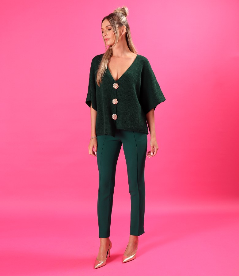 Relaxed-knit cardigan with gold buttons and feather trousers